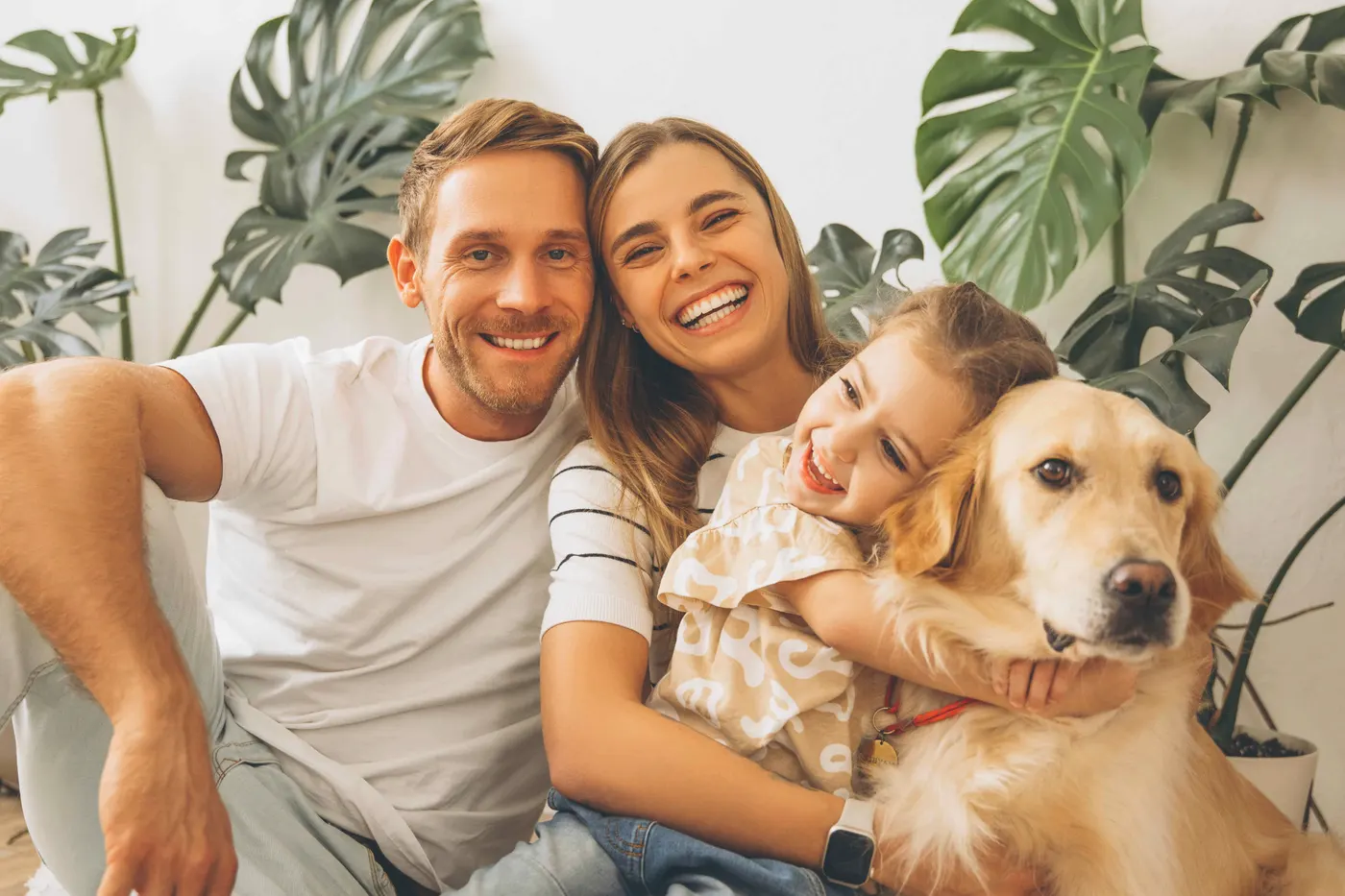 Happy family with pet in their eco-friendly cleaned home